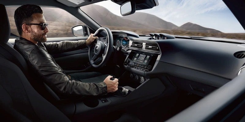 A man driving a 2024 Nissan Z