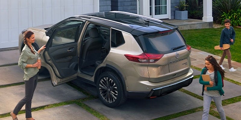 2025 Nissan Rogue parked in front of a house