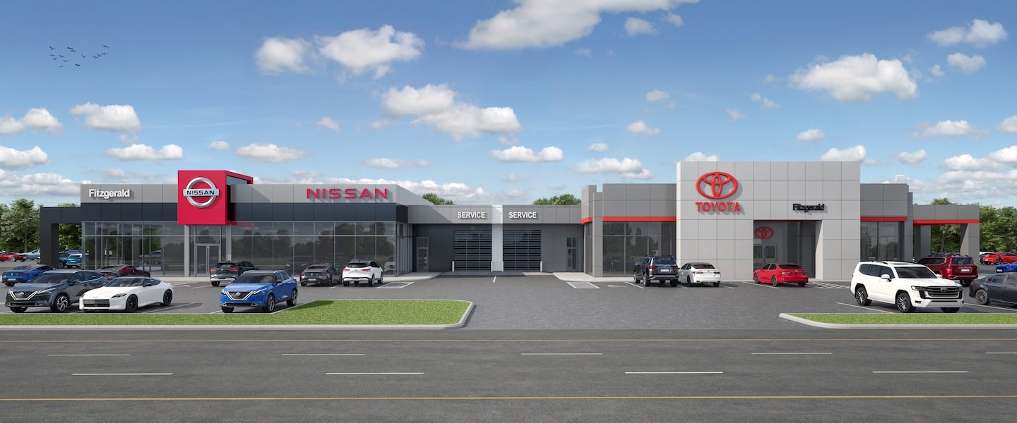 Nissan & Toyota showroom exterior with parked cars